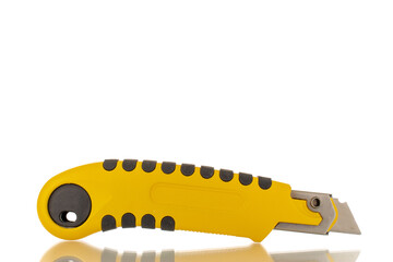 One construction knife, close-up, isolated on a white background.