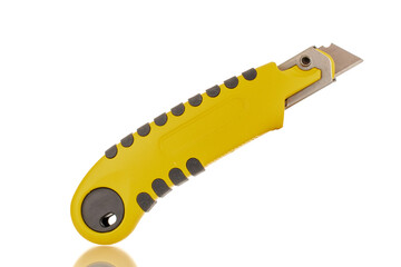 One construction knife, close-up, isolated on a white background.