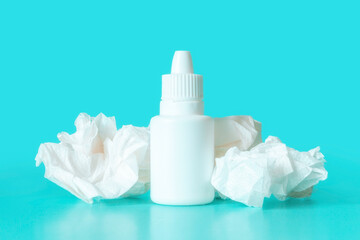 spray and nasal drops concept allergy, cold, flu on the background of used wipes