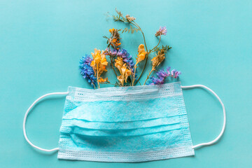 protective face mask with flowers and pollen allergy concept