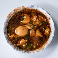 Asian food, boiled eggs in brown sauce or sweet gravy golden brown eggs Add spices, known as scrambled eggs.