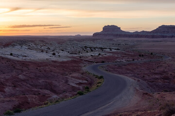 Scenic Road in Red Rock Mountains in the Desert at Sunrise.