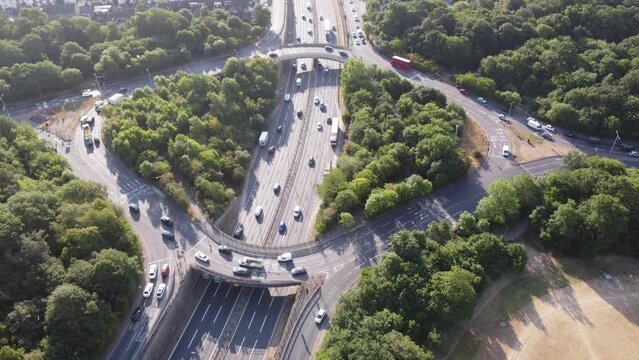 Aerial view of the waterworks roundabout in the morning sun looking east down the A406 dual carriageway into Woodford. London 