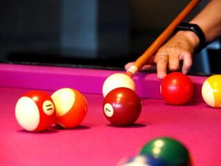 American pool with billiard balls on pink table. Snooker.