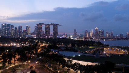 Top view of cityscape at Sand Sky Park Singapore at twilight time. Shot. Top view of Singapore in the evening