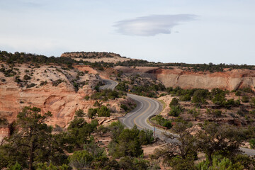 Scenic Road surrounded by Red Rock Mountains in the Desert.