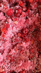 Raspberries in sugar. Preparing raspberries for making jam