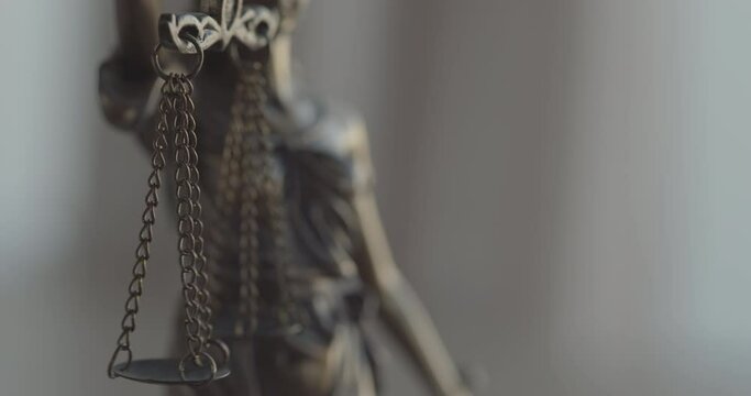 Legal and law concept statue of Lady Justice on blurred background