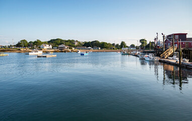 Fototapeta na wymiar sailboats anchored in a bay of Maine coast fishing port, Bailey Island