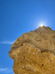 Sun on top of rock 
