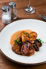 medallions of beef with baked mini potatoes with mushrooms
