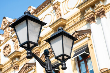 Fototapeta na wymiar old metal lantern on the background of a house in a European city