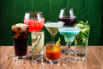 Set of various alcohol cocktails on table