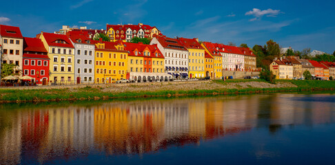 2022-05-04 panoramic view of colorful houses with reflection in the water. zgorzelec, poland