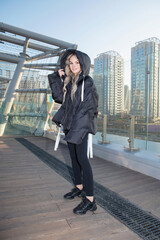 Obraz premium Lovely blonde dressed in a warm jacket and pants