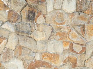 Textured sandstone wall masonry cladding. Flat stone masonry texture. Wall cladding with coarse...