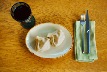 a khinkali in a plate. Georgian cuisine.