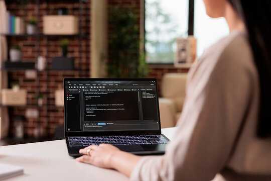 Software developer learning new program code on terminal window, using online cloud app server at home. Programming new user interface with css html script and application development.