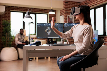 Developer using vr goggles to manufacture gears product with virtual reality technology and cad...