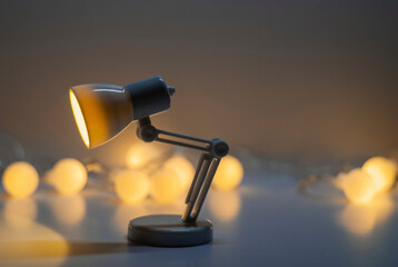 Modern lamp on the table. Light bulb.