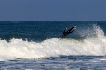 Surfing on high waves in the Mediterranean.