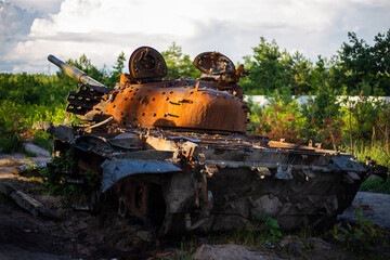 The smashed and burned modern tank of the russian army in Ukraine in the war in 2022