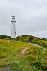 Fototapeta na wymiar Shell Lighthouse in a rainy day in Ilha do Mel (Honey Island), Paraná, Brazil