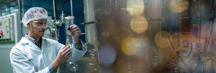 Professional Scientist holding Cannabis oil bulbs and checking vaporizer during CBD oil extraction...