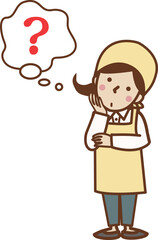 腕を組み、考え事をするエプロン姿の女性。