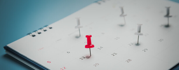 Embroidered red pins on a calendar event Planner calendar,clock to set timetable organize...