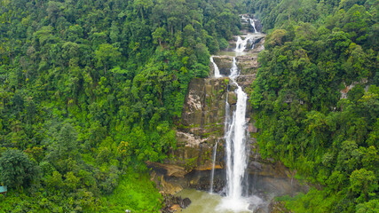 Tropical Aberdeen Falls in mountain jungle, Sri Lanka. Waterfall in the tropical forest.