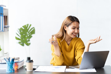 Fototapeta premium Portrait of smile beautiful business asian woman working office desk computer. Small business sme people employee freelance online startup marketing designer telemarketing successful.