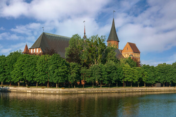 Fototapeta premium View of the Koningberg Cathedral on Immanuel Kant Island and the Pregolya River on a sunny summer day, Kaliningrad, Russia