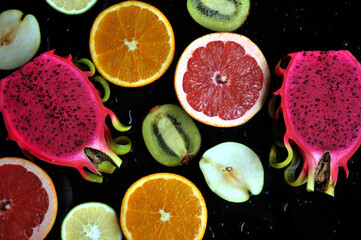 Fresh oranges、pitaya and kiwi sliced on a plait