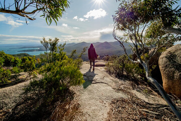 super woman on a top of the mountain  at freycinet national park Tasmania Australia ( sleepy bay )