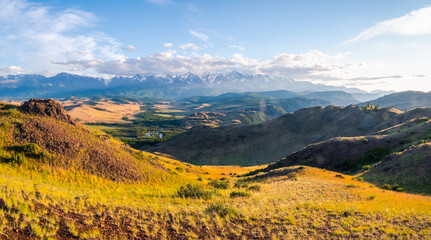Bright autumn Kurai steppe landscape. Steppe on the background of mountains. Panoramic view, Altai region.