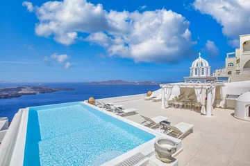 Fotobehang Luxury vacation landscape with infinity swimming pool caldera over Mediterranean sea view. White architecture on Santorini island, Greece. Beautiful terrace, white decoration summer travel background © icemanphotos