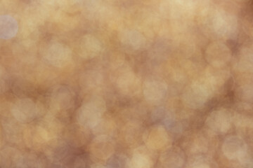 Gold light shiny bokeh abstract blur background with bright round defocus golden pattern.