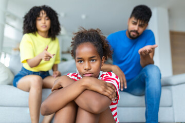 Naughty Kid. Annoyed Parents Scolding Their Little Daughter For Her Behaviour While Sitting Together On Couch At Home - obrazy, fototapety, plakaty