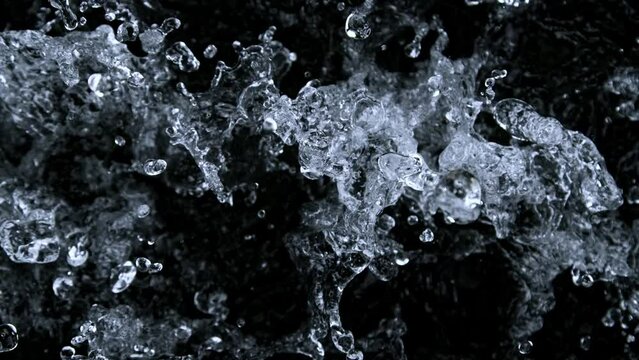Super Slow Motion Shot of Splashing Water Isolated on Black Background at 1000 fps.