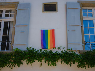 Pride flag flies on the stoop of Basel house