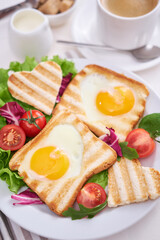 Fried Egg on Toast Bread and cup of fresh hot coffee on light grey background
