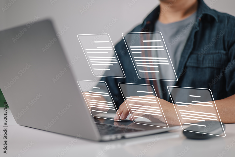 Aufkleber Laptop computer with electronic document icons, E-document management, an online documentation database, and the notion of a paperless workplace in mind for a businessman.