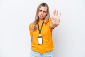 Young caucasian woman with ID card isolated on white background making stop gesture