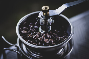 preparing coffee while camping. manual coffee grinder