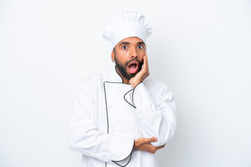 Young Brazilian chef man isolated on white background surprised and shocked while looking right