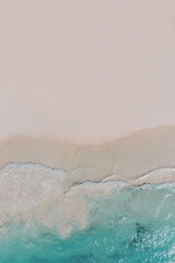 Beach top view, beautiful seashore, sand and blue waves. drone shooting, natural background. Copy the space on the sand, free space for your design