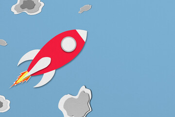 red paper spaceship flying in space with meteors