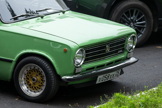 Vladivostok, Russia - July 14, 2022:  green VAZ 2101   is parked  on the street on a warm summer day against the backdrop of a parking