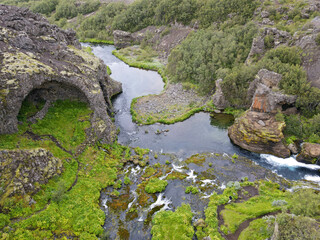Naklejka na ściany i meble Drone view at the waterfalls of Gjain in Iceland